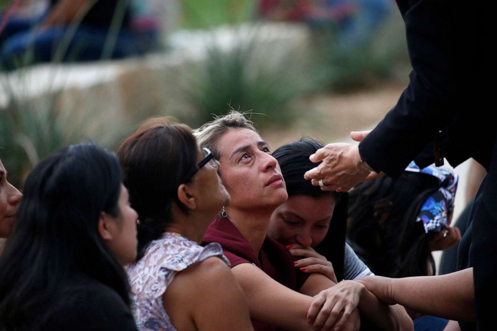 PHOTO: The archbishop of San Antonio, Gustavo Garcia-Siller, comforts families outside of the Civic Center in Uvalde, Texas, May 24, 2022. 
